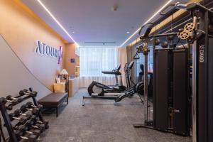 a gym with exercise equipment in a hotel room at Atour Hotel Wuhan Guanshan Avenue Guanggu Software Park in Wuhan