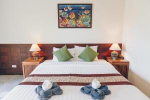 Postel nebo postele na pokoji v ubytování Krabi Sands Resort