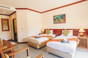 Postel nebo postele na pokoji v ubytování Krabi Sands Resort
