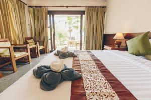 Postel nebo postele na pokoji v ubytování Krabi Sands Resort