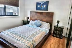 Ένα ή περισσότερα κρεβάτια σε δωμάτιο στο Beautiful New home in Throsby with 5 Bedrooms +9 φωτογραφίες