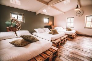 Ένα ή περισσότερα κρεβάτια σε δωμάτιο στο CRASH'NSTAY - 't Silo Huis