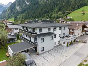 an aerial view of a house in a mountain at Apart Alina in Schwendau