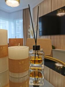 Televízia a/alebo spoločenská miestnosť v ubytovaní Gold Apartment B29 Let's Sea Baltic Park Gąski