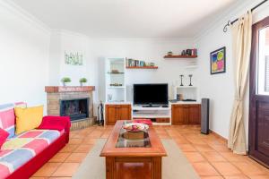 Televízia a/alebo spoločenská miestnosť v ubytovaní Casa Bellavista