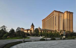 a city with tall buildings and a road in front at Howard Johnson Agile Plaza Chengdu in Chengdu
