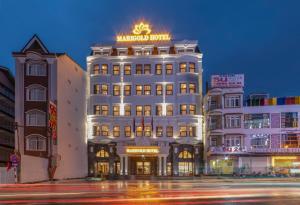 a building with a sign on top of it at Marigold Hotel Dalat in Da Lat