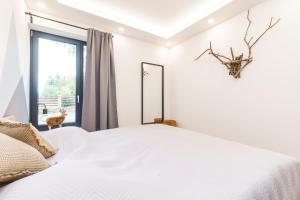 Postelja oz. postelje v sobi nastanitve Apartmán SKI Plešivec