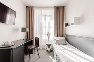 Ένα ή περισσότερα κρεβάτια σε δωμάτιο στο Hotel Pivoňka +37 φωτογραφίες