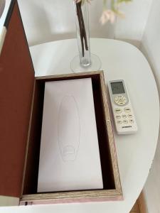 a picture of a computer mouse and a remote control on a table at APHRODITE 2 Bedroom Apartment Down Town Nicosia By Platform 357 in Nicosia +21 photos