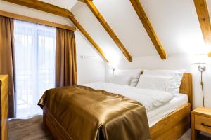 Posteľ alebo postele v izbe v ubytovaní Ski Chalet Klínovec