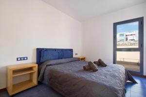 A bed or beds in a room at My Favorite Home