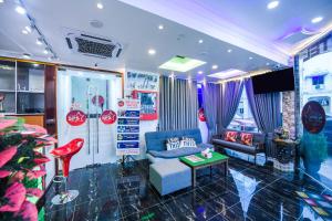 a living room with a couch and a table at SP Star Hotel in Sungai Petani