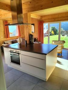 a kitchen with a stove and a counter top at Spatzennest in Hohentauern