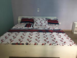 a bed in a bedroom with at Residence MaryHouse in Cotonou