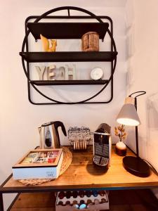 a desk with a telephone and a lamp on it at Echternacher Hof - Moselloft in Kinheim