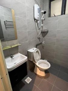a bathroom with a toilet and a sink at Relaxation Homestay 3BR(7Pax)Pool View@Meru Ipoh in Ipoh