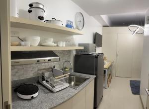 Kuchyň nebo kuchyňský kout v ubytování South Residences Tower 3