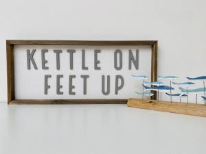 a picture frame with the words kittle on feet up at Coast House Cromer - Sleeps 15, hot tub, sea views in Cromer