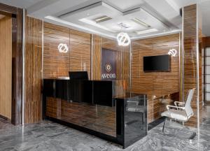 TV a/nebo společenská místnost v ubytování Aveon Hotel