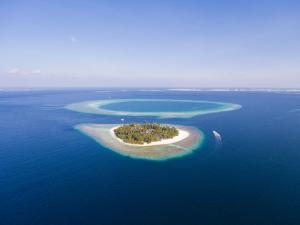 a small island in the middle of the ocean at Malahini Kuda Bandos Resort in North Male Atoll