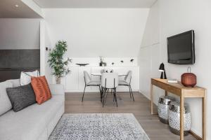 a living room with a couch and a table at Prata Riverside Apartment in Lisbon
