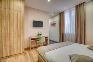 Postel nebo postele na pokoji v ubytování Orbeli Hotel Yerevan