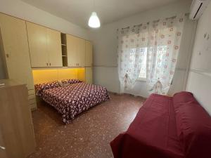 Postel nebo postele na pokoji v ubytování Scauri Holiday