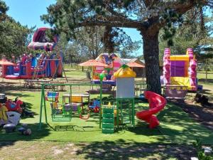 a playground with a bunch of different types of play equipment at SHABBY FUFU LIFESTYLE FARM in Plettenberg Bay