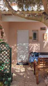 a room with a bed and a door in a building at Mas de la garrigue 13 in Saint Pierre La Mer