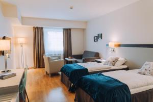 เตียงในห้องที่ Skaslien Hotel & Guesthouse