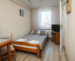 Łóżko lub łóżka w pokoju w obiekcie Pokoje w Kuźnicy u Andrzeja