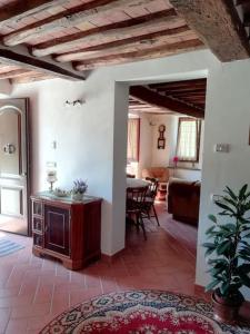 a living room with a couch and a table at Ai tre Campi in Fornaci di Barga