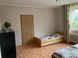 Postel nebo postele na pokoji v ubytování Chata Sovička