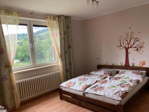 Postel nebo postele na pokoji v ubytování Chata Sovička
