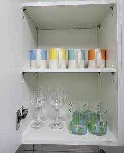 a shelf with wine glasses and cups on it at Newly renovated hidden gem #2 in Seoul