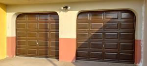 two sets of garage doors in a building at Mucha Airbnb in Walvis Bay