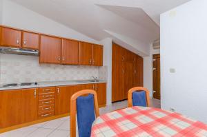 Kuchyň nebo kuchyňský kout v ubytování Apartments Milivoj