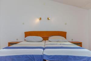Postel nebo postele na pokoji v ubytování Apartments Milivoj