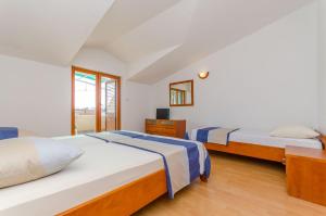 Postel nebo postele na pokoji v ubytování Apartments Milivoj