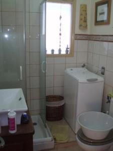 a bathroom with a toilet and a sink and a window at Apartment - 1 Bedroom with WiFi and Sea views - 01990 in Las Marciegas