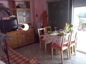 a kitchen with a table and chairs and a television at Apartment - 1 Bedroom with WiFi and Sea views - 01990 in Las Marciegas