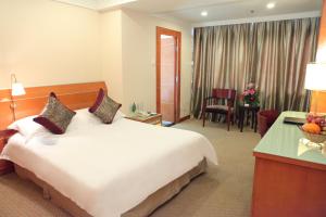 Voodi või voodid majutusasutuse Yihe Hotel Ouzhuang toas