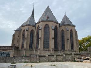 a large church with tall spires at Studio La Rose in Arnhem