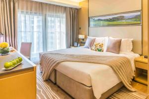 a hotel room with a large bed with two teddy bears on it at Somerset Grandview Shenzhen in Shenzhen