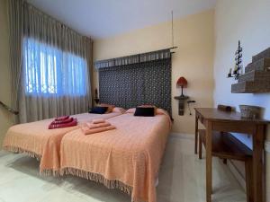 Postel nebo postele na pokoji v ubytování B3 Bajo con terraza de 64m2 totalmente equipado + 22 fotografií