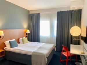 Letto o letti in una camera di Quality Hotel Globe