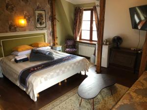 a bedroom with a bed and a chair and a window at Paivilla Boutique Hotel in Tallinn