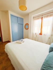 Postel nebo postele na pokoji v ubytování Blue House in Santa Pola