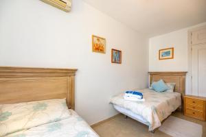 Ein Bett oder Betten in einem Zimmer der Unterkunft Doña Lola Sea view apartment